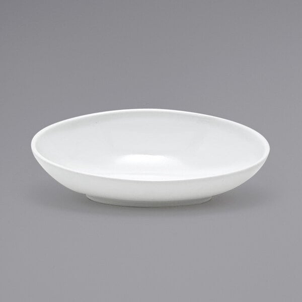 A Front of the House white oval porcelain bowl on a gray background.