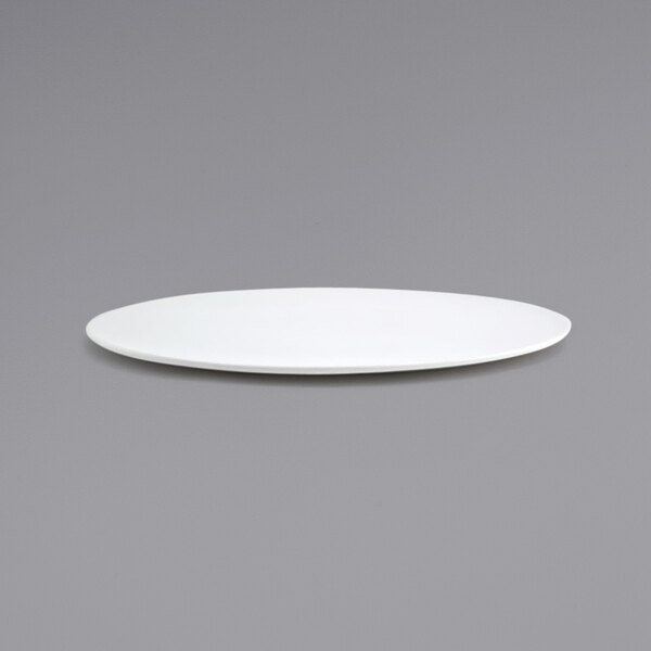 A white Front of the House porcelain plate with a small rim on a gray background.