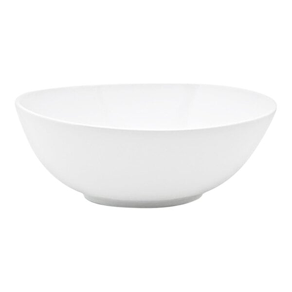 A white oval porcelain bowl with tall sides.