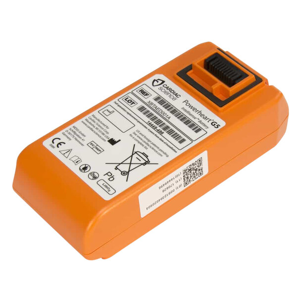 An orange Cardiac Science battery pack with a barcode label.