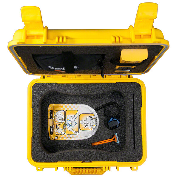 A yellow Defibtech watertight hard case.