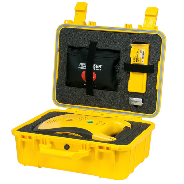 A yellow Defibtech hard case with black handles holding a Lifeline AED.