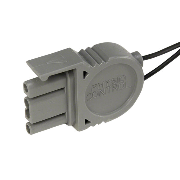A grey Physio-Control CHARGE-PAK device with a black wire.