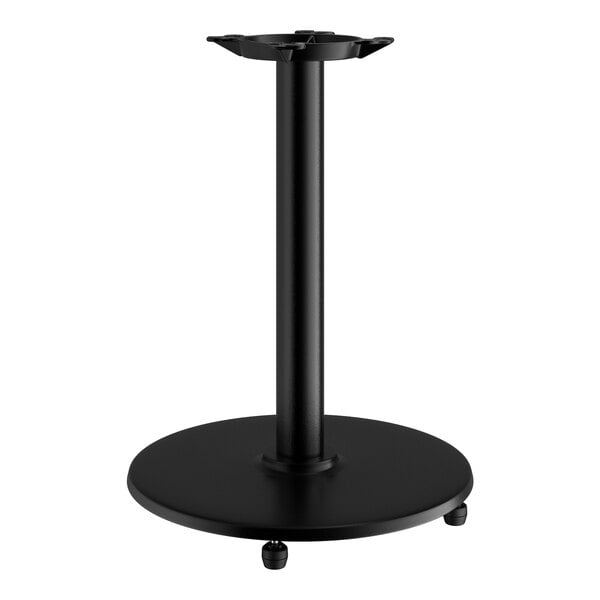A black Lancaster Table & Seating cast iron table base with a round base and pole.