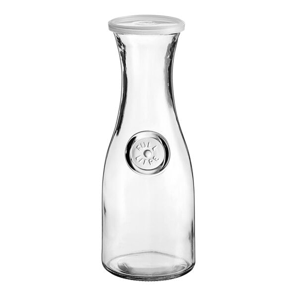 A clear glass Anchor Hocking carafe with a white plastic lid.