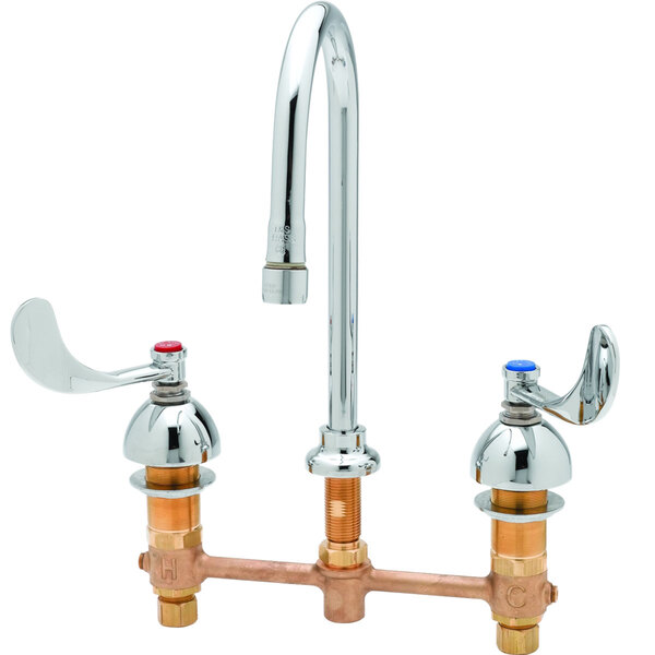 A white T&S deck mount medical lavatory faucet with two 4" wrist action handles.
