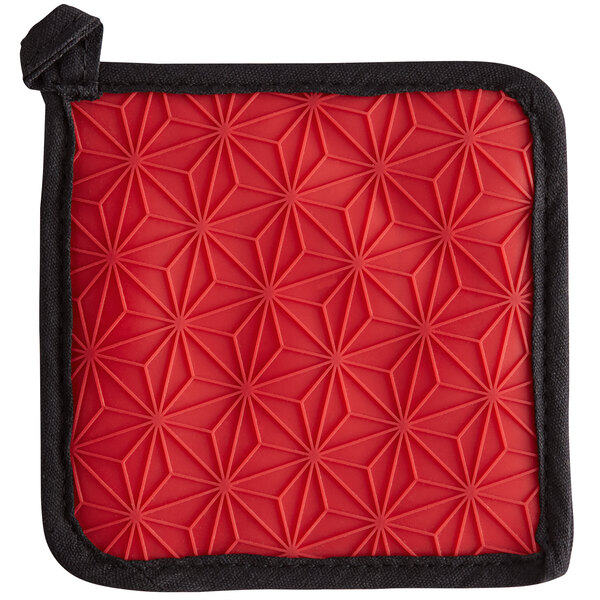 A red square Lodge pot holder with a black border.