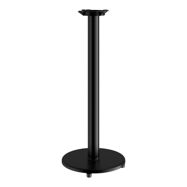 A black Lancaster Table & Seating bar height table base with a round base.
