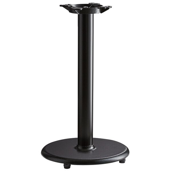 A black Lancaster Table & Seating cast iron table base.