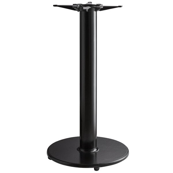 A black metal Lancaster Table & Seating bar height table base with a metal stand.