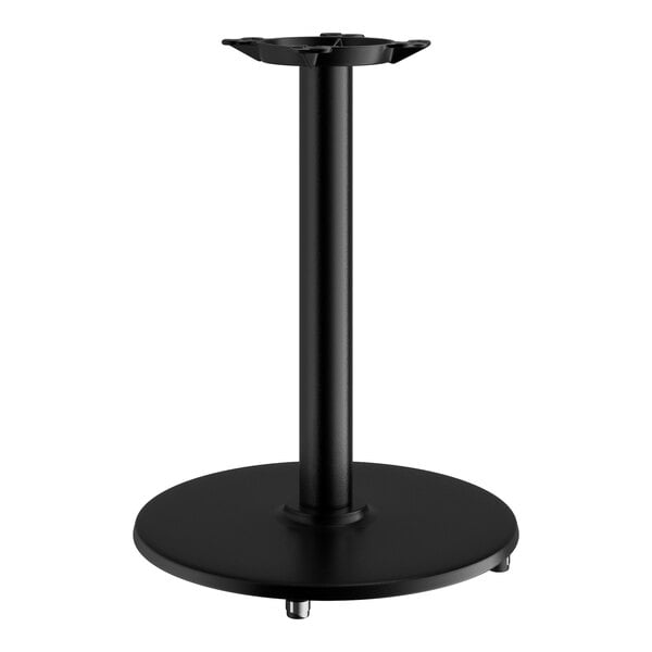 A black Lancaster Table & Seating cast iron table base with a round stand.