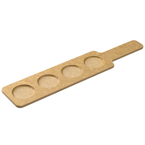 A Tomlinson Richlite wood board with four circles on it.