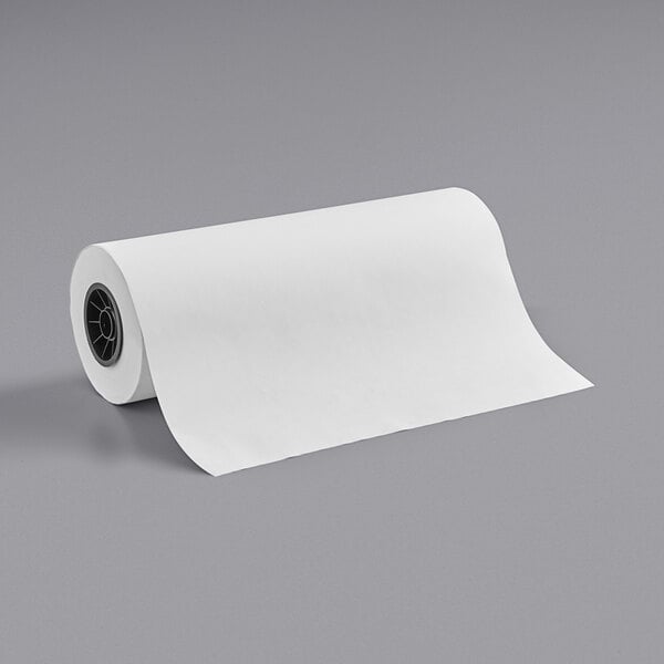 A roll of white butcher paper on a gray surface.