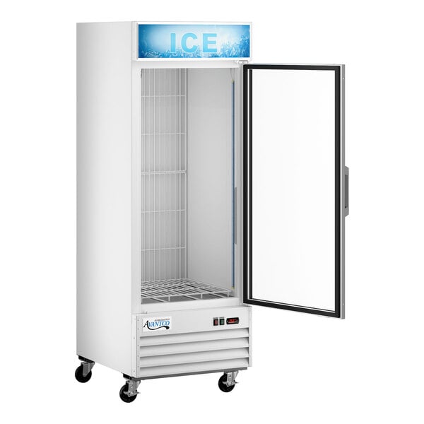 An upright white indoor ice merchandiser with a glass door, customizable signage, and caster wheels.