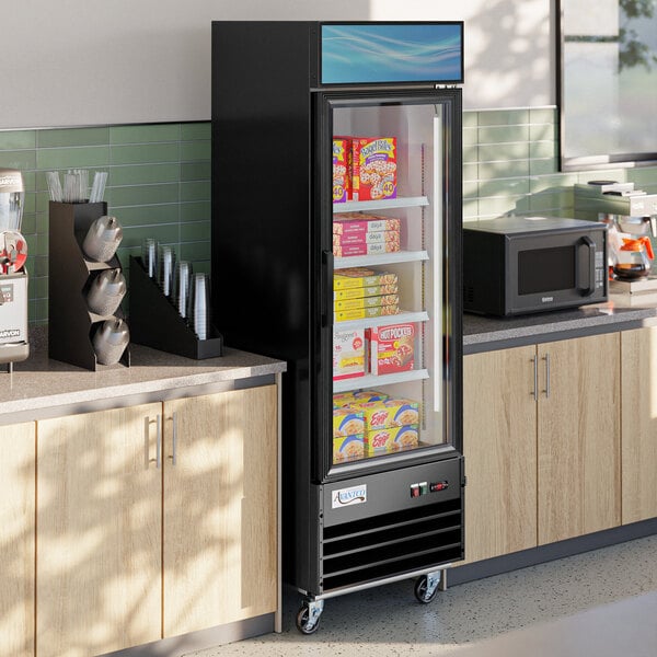 A black Avantco swing glass door freezer with LED lighting and shelves full of boxes.