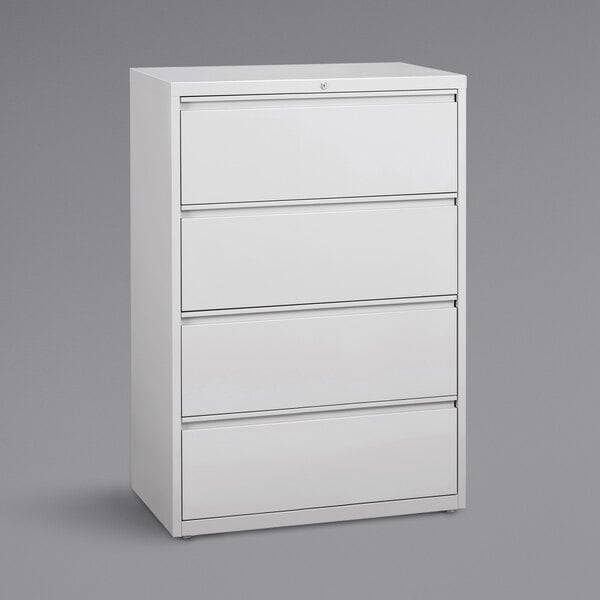 A white Hirsh Industries lateral file cabinet with four drawers.