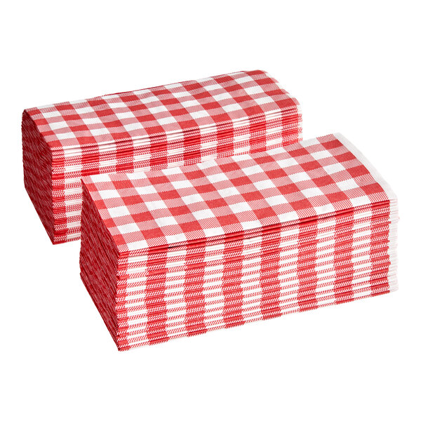 A stack of red and white gingham-patterned 2-ply dinner napkins.