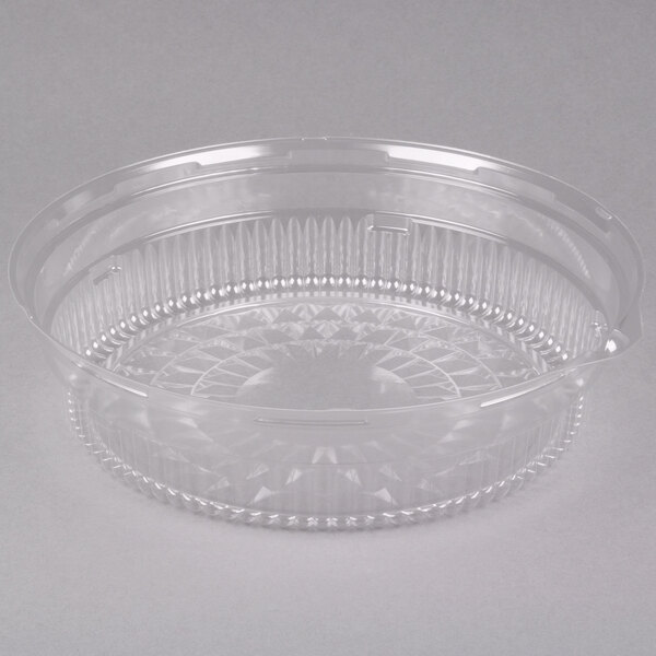 A clear plastic container with a round lid.