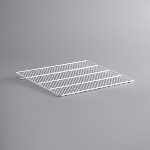 A white metal grid shelf for an Avantco deli case.