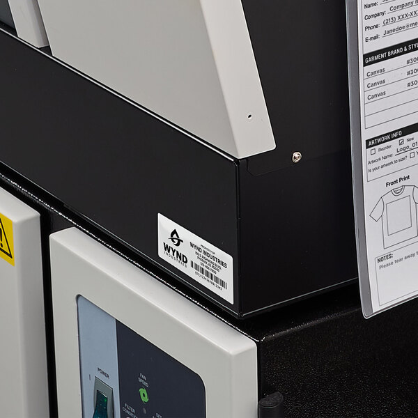 A machine with a Avery white rectangular label on it.