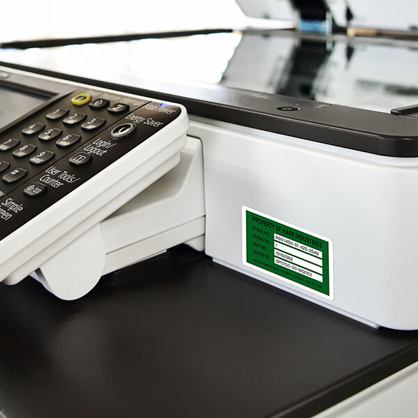 Avery PermaTrack Destructible Asset Labels being printed on a printer.