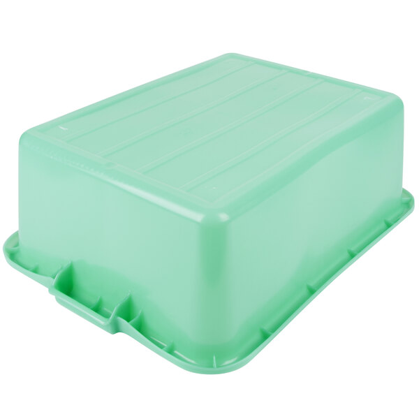A green Vollrath Traex plastic food storage box with a lid.