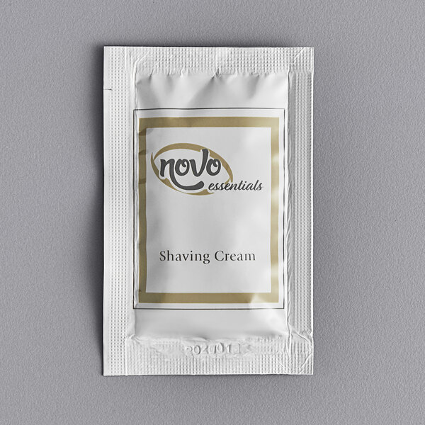A white Novo Essentials packet of shaving cream.