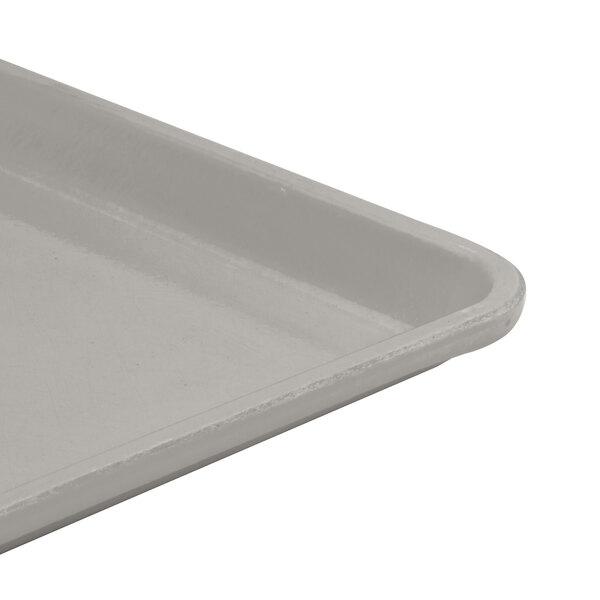 A close-up of a Cambro Pearl Gray Dietary tray with a white bottom and gray top.