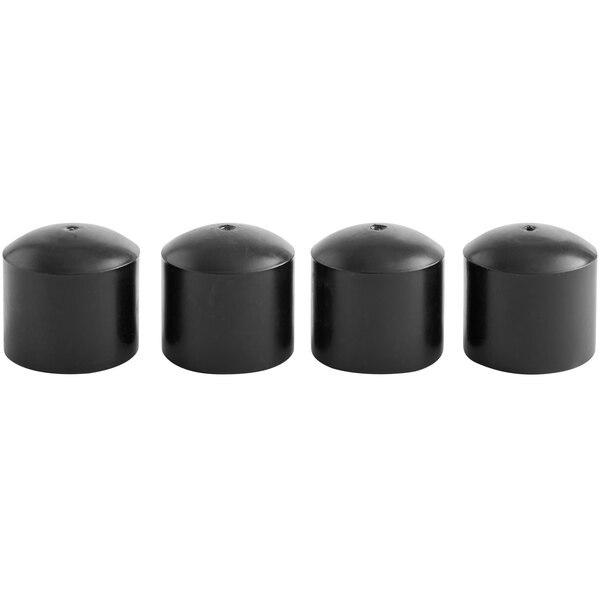 A row of black plastic caps with a hole in the center.