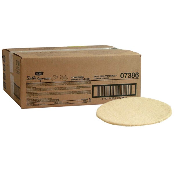 A box of Rich's Fresh N Ready pizza crust dough sitting on a white surface.