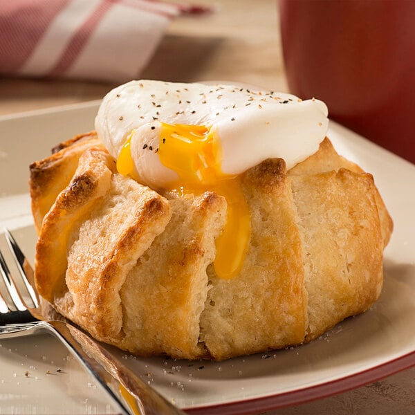 A Rich's freezer-to-oven pizza crust on a plate with a fork.