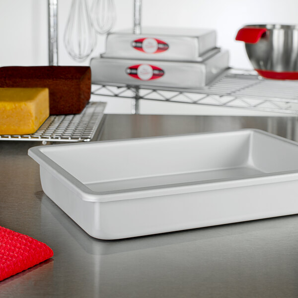 A Fat Daddio's rectangular cake pan on a counter.