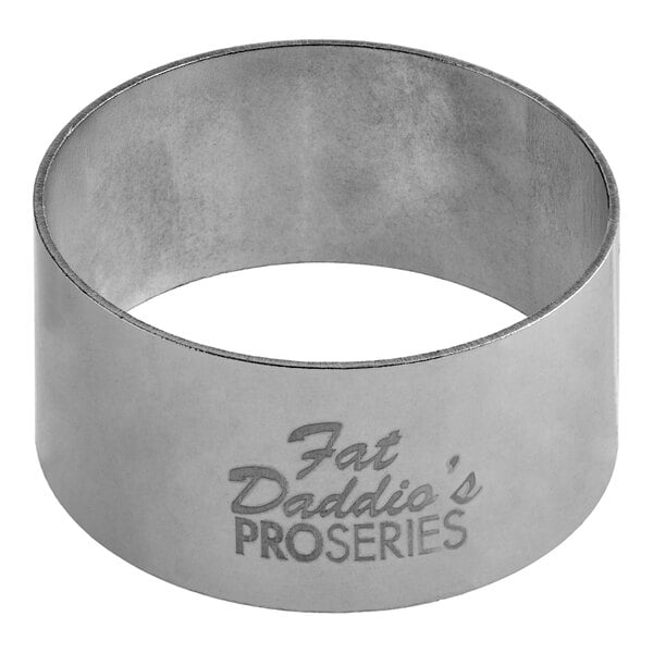 A stainless steel circular ring mold with "Fat Daddio's ProSeries" text on it.