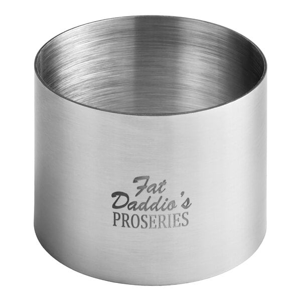 A silver stainless steel round cake ring mold with the words "Fat Daddio's ProSeries" on it.