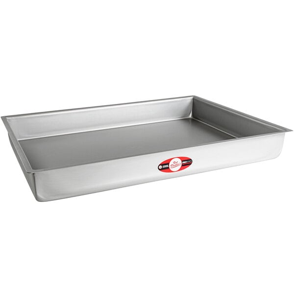 A rectangular silver cake pan with straight sides and a red label.