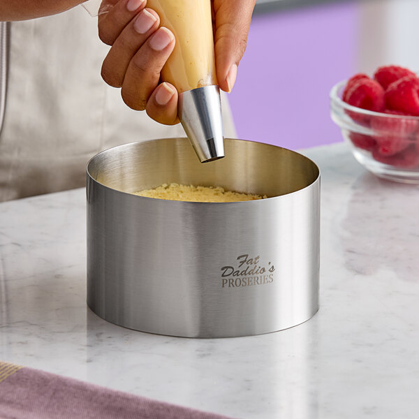 A stainless steel round cake and food ring mold from Fat Daddio's ProSeries, measuring 5 inches by 3 inches.
