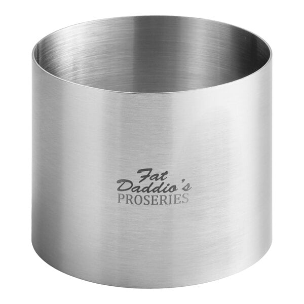 A silver stainless steel round cake and food ring mold.