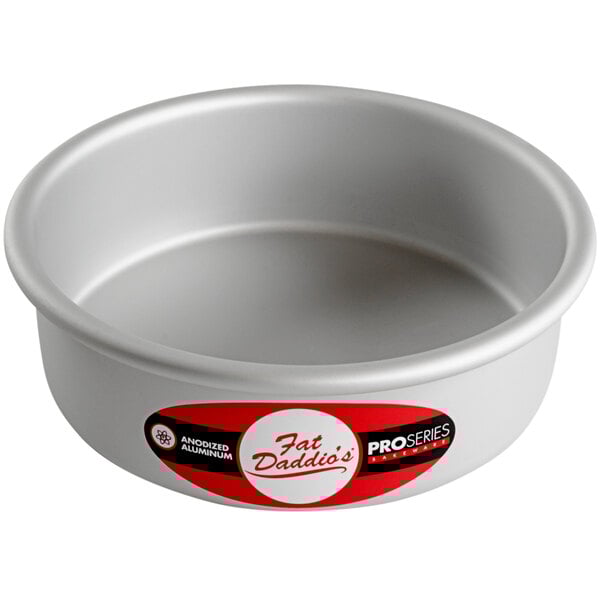 A round silver Fat Daddio's cake pan with a red label.