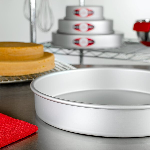 A Fat Daddio's round cake pan on a table.