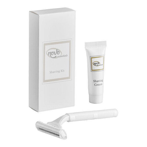 A shaving kit containing a disposable razor, a small tube of shaving cream, and a rectangular carton box.