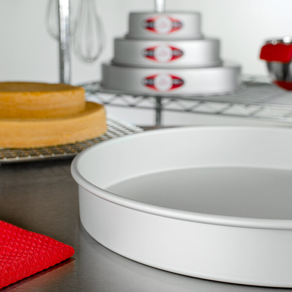 A Fat Daddio's round cake pan on a counter.