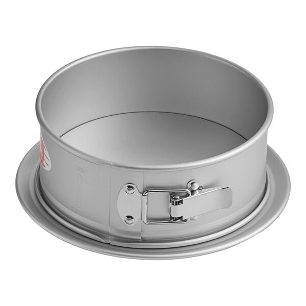 A round metal Fat Daddio's springform cake pan with a handle.