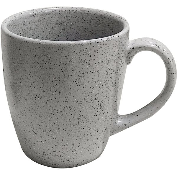 A white speckled coffee mug with gray speckles.