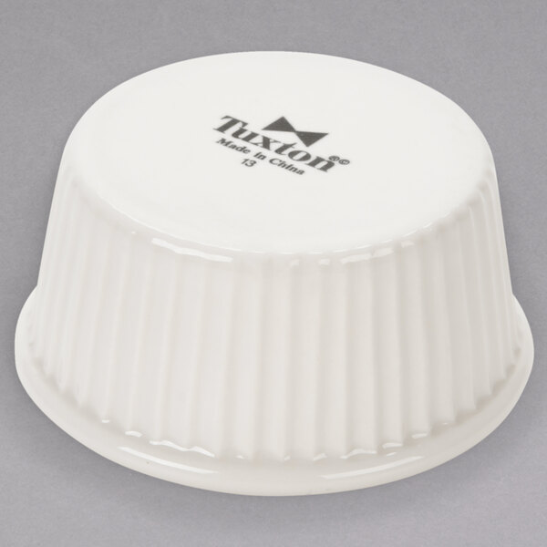 A white bowl with black text that reads "Tuxton" on it.