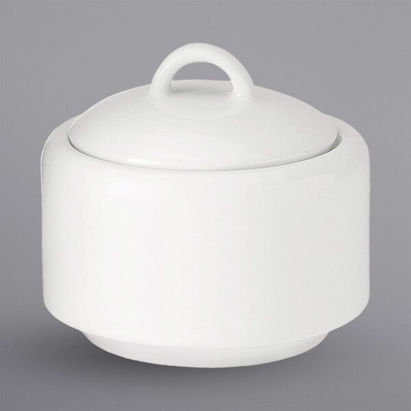 A white porcelain bowl with a curved shape and a lid.