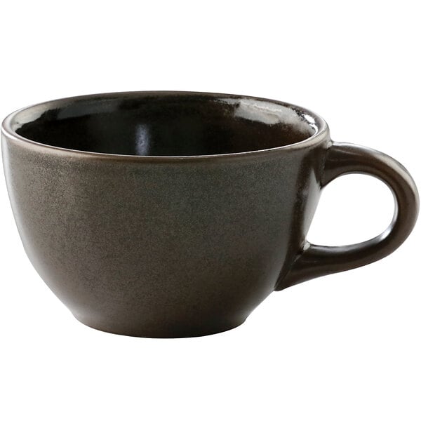 A brown tea cup with a handle.