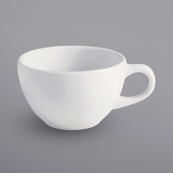 A white porcelain cup with a handle.