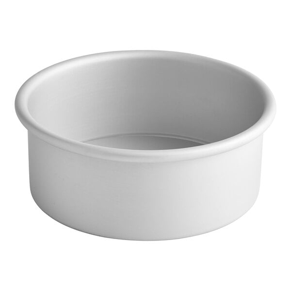 A white round Fat Daddio's cake pan with a removable bottom.