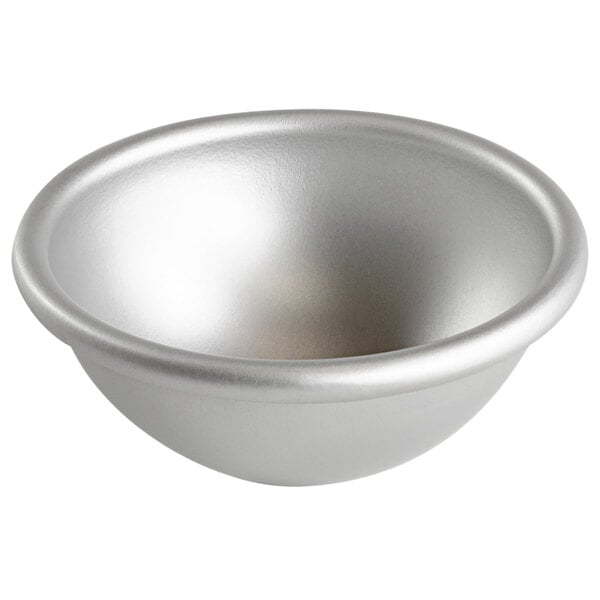 A silver hemisphere cake pan.