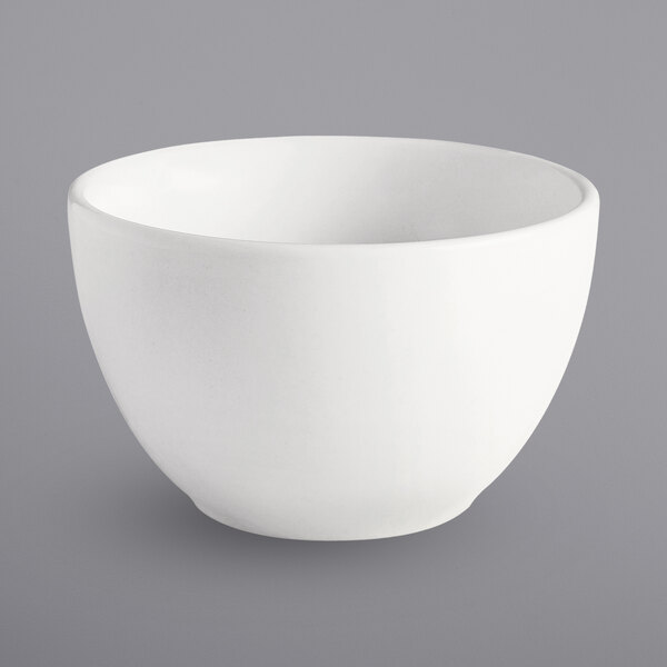 A close up of a Bright White porcelain bouillon cup.